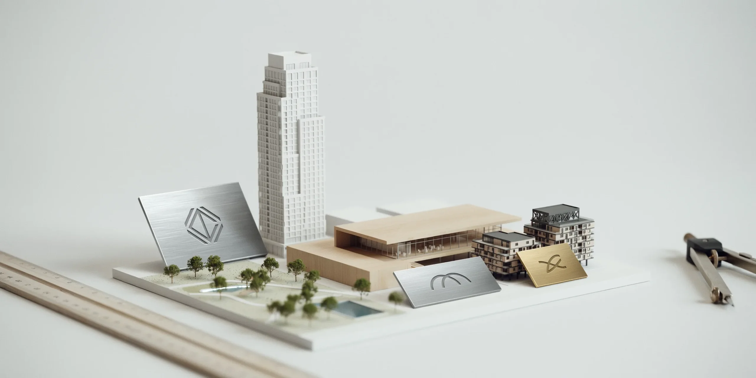 Architectural models and logos of top-rated firms representing good employer reputation.